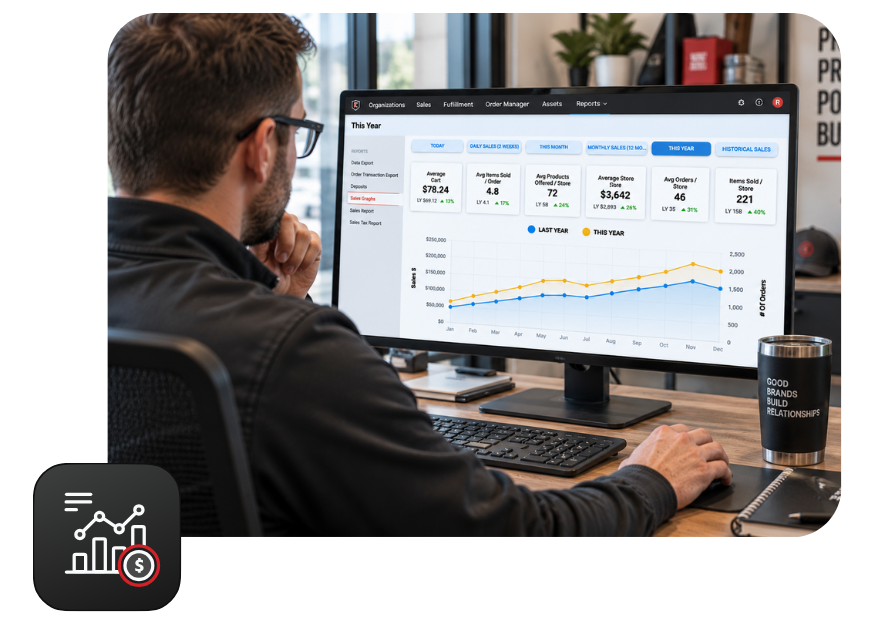 Promo distributor working at a computer with a sales report on screen. 