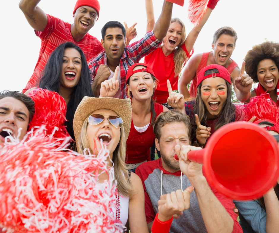 People cheering at a sporting event People cheering at a sporting event